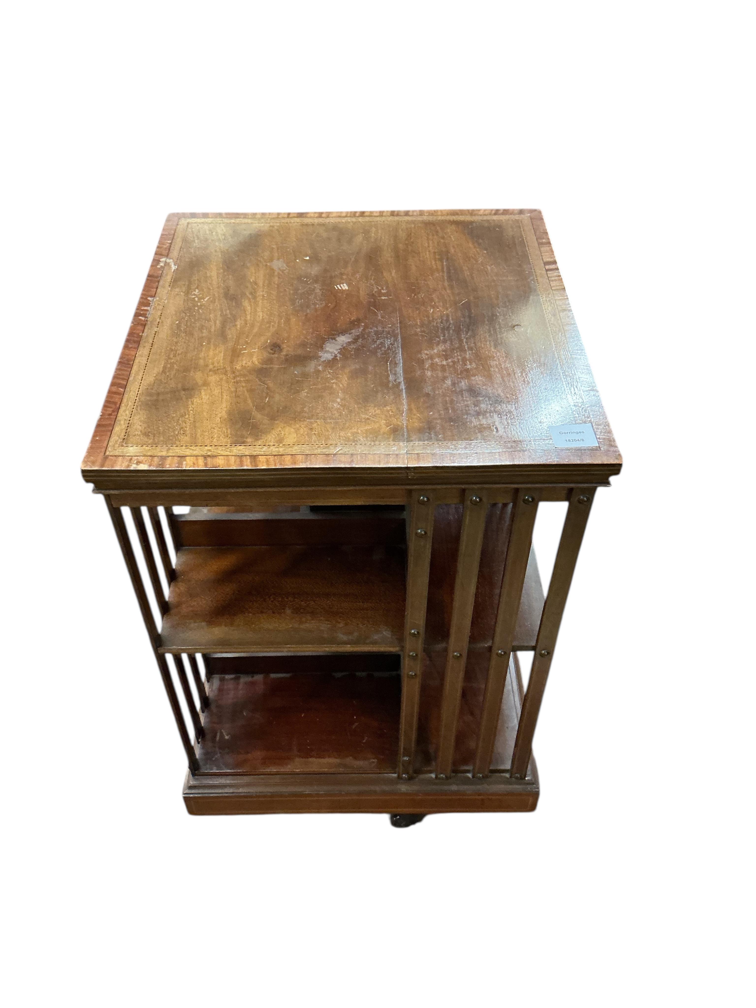 An Edwardian inlaid mahogany revolving bookcase, width 49cm, depth 49cm, height 86cm
